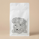 White coffee bag with a black line drawing of a dog's face on a beige background