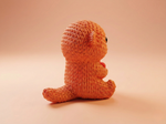 Knitted toy on a beige background