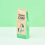Prana Chai vegan blend package on a light green background