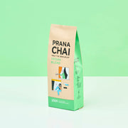 Prana Chai vegan blend package on a light green background