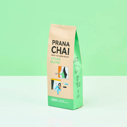 Prana Chai vegan blend package on a light green background