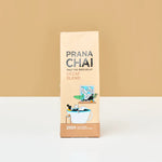 Prana Chai Decaf Blend packaging on a beige background