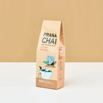 Prana Chai decaf blend package on a beige background