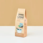 Prana Chai decaf blend package on a beige background