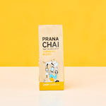 Prana Chai package on a yellow background