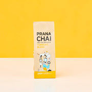 Prana Chai package on a yellow background